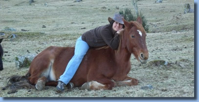 Alejandra sitting on Regalona, lying down.